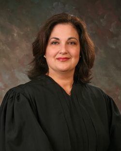 Pictures of Honorable Gina M. Groh, Chief United States District Judge of the United States District Court for the Northern District of West Virginia.