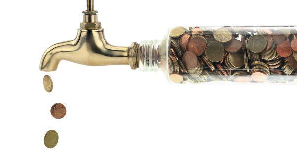 Pipe and faucet pouring out money in coin form