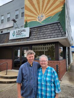 Clients Bobby and Lisa stand together outside the Legal Aid office where they got help