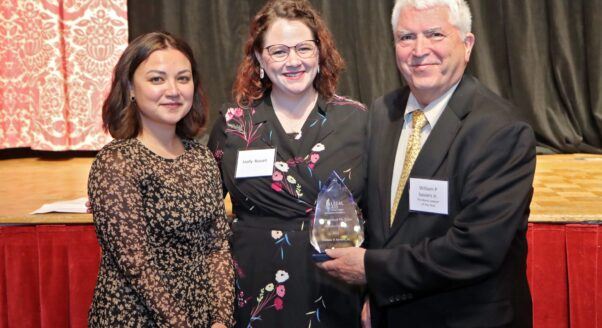 William P. Saviers, Jr. (right) accepts the Distinguished Pro Bono Award from Molly Russell (center) and Maria Borror (left), of Legal Aid of West Virginia.