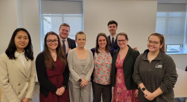 law students and legal aid staff pose at the Kanawha County Public Library after a clinic on March 13.