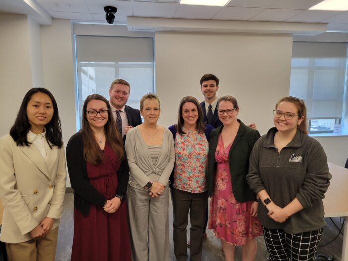 law students and legal aid staff pose at the Kanawha County Public Library after a clinic on March 13.