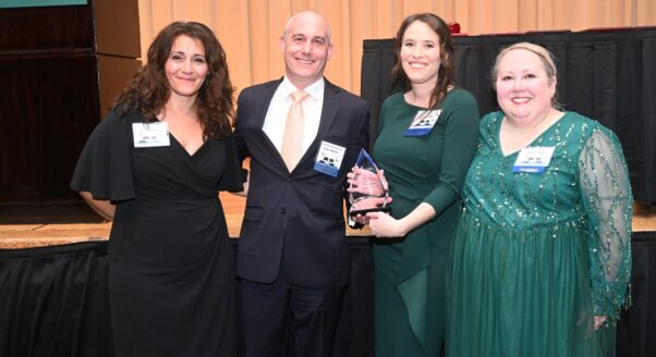 Bailey Glasser receiving the Distinguished Pro Bono Award