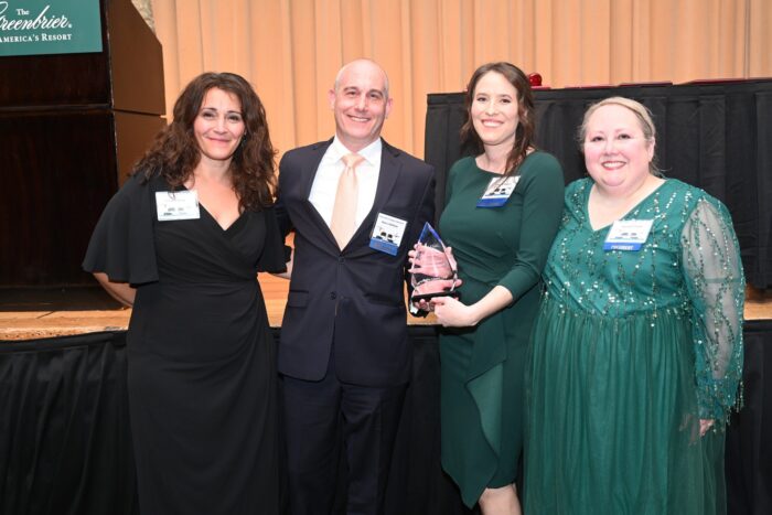 Bailey Glasser receiving the Distinguished Pro Bono Award