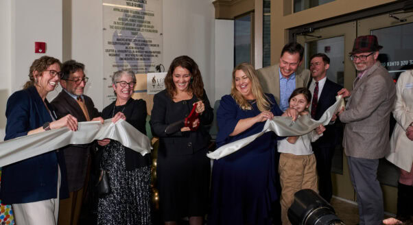 Kate White cuts ribbon at Charleston offices
