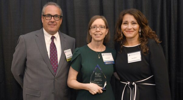 Lisa Hawrot (center) accept the 2025 award