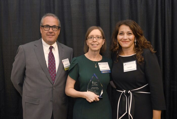 Lisa Hawrot (center) accept the 2025 award