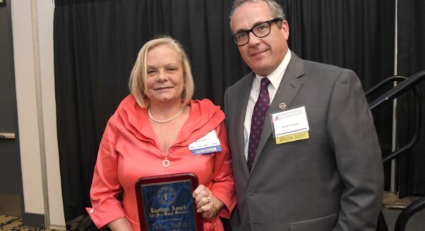 Paula Harbour (left) accepts the 2025 Kaufman Award