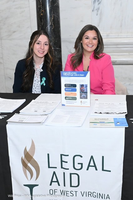 Kaylie (right) sits with Lauren at the WV State Capitol during an outreach day at the legislature